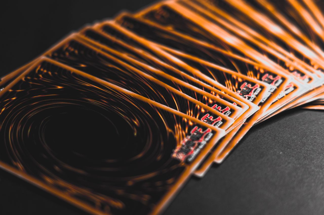 Crafting Captivating Headlines: Your awesome post title goes here Close-up view of collectible trading cards in a fan arrangement, highlighting intricate patterns.